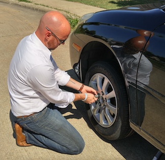 how to change a tire on a car - the sharp gentleman